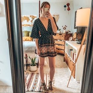SOLD: Deep-V black floral romper